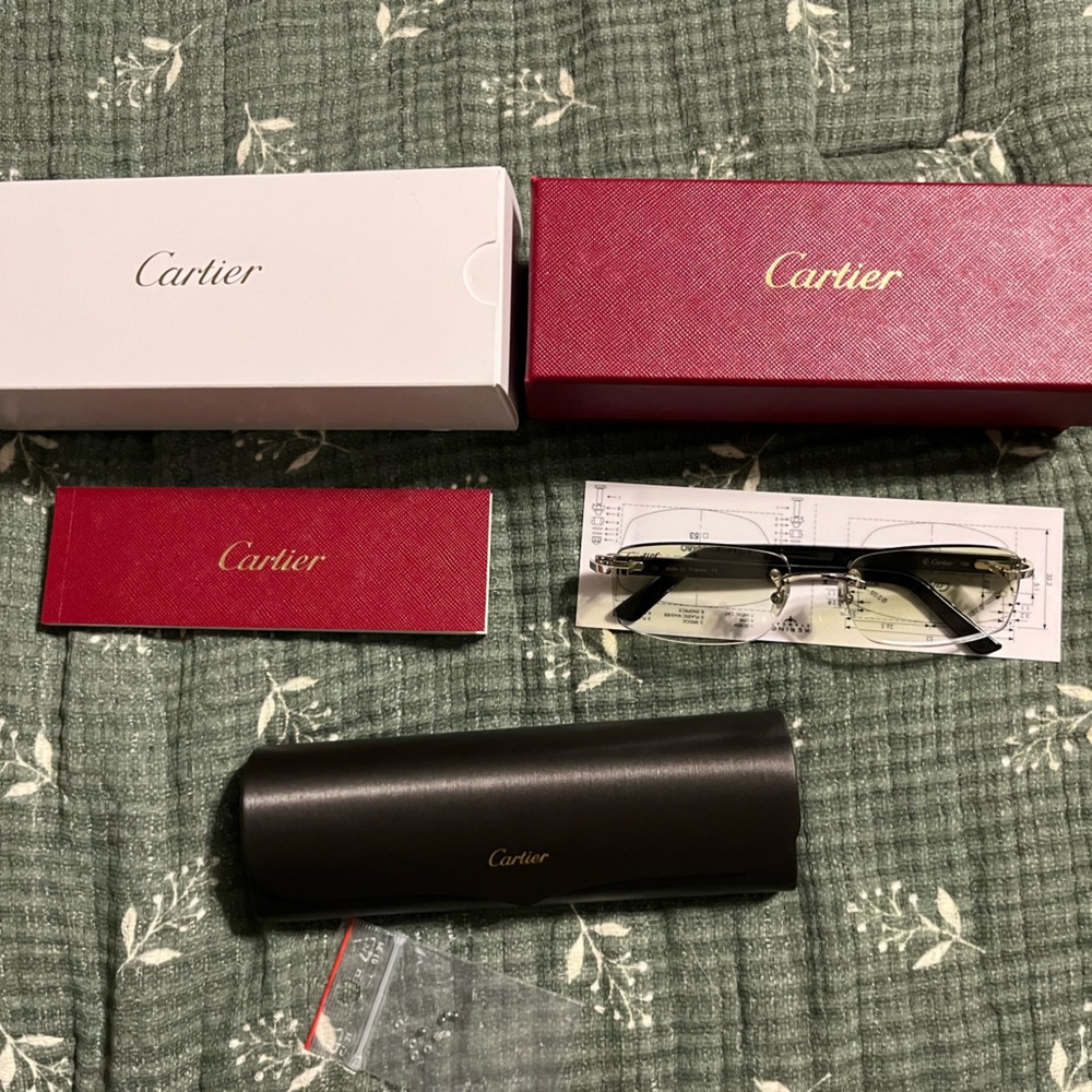 Men’s Cartier Glasses with a green tint.